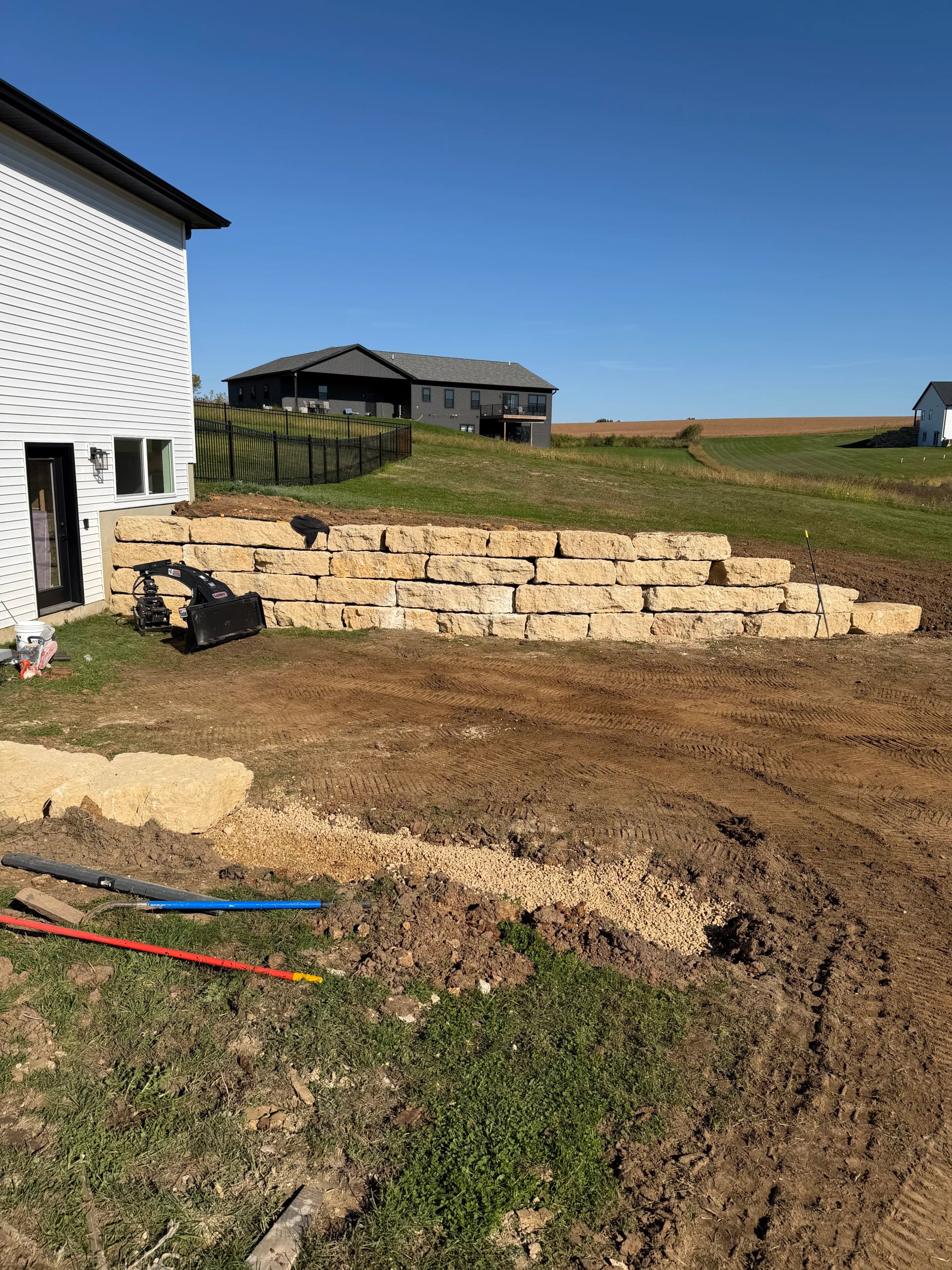 Limestone Retaining Wall Built for Grade and Support in Platteville image