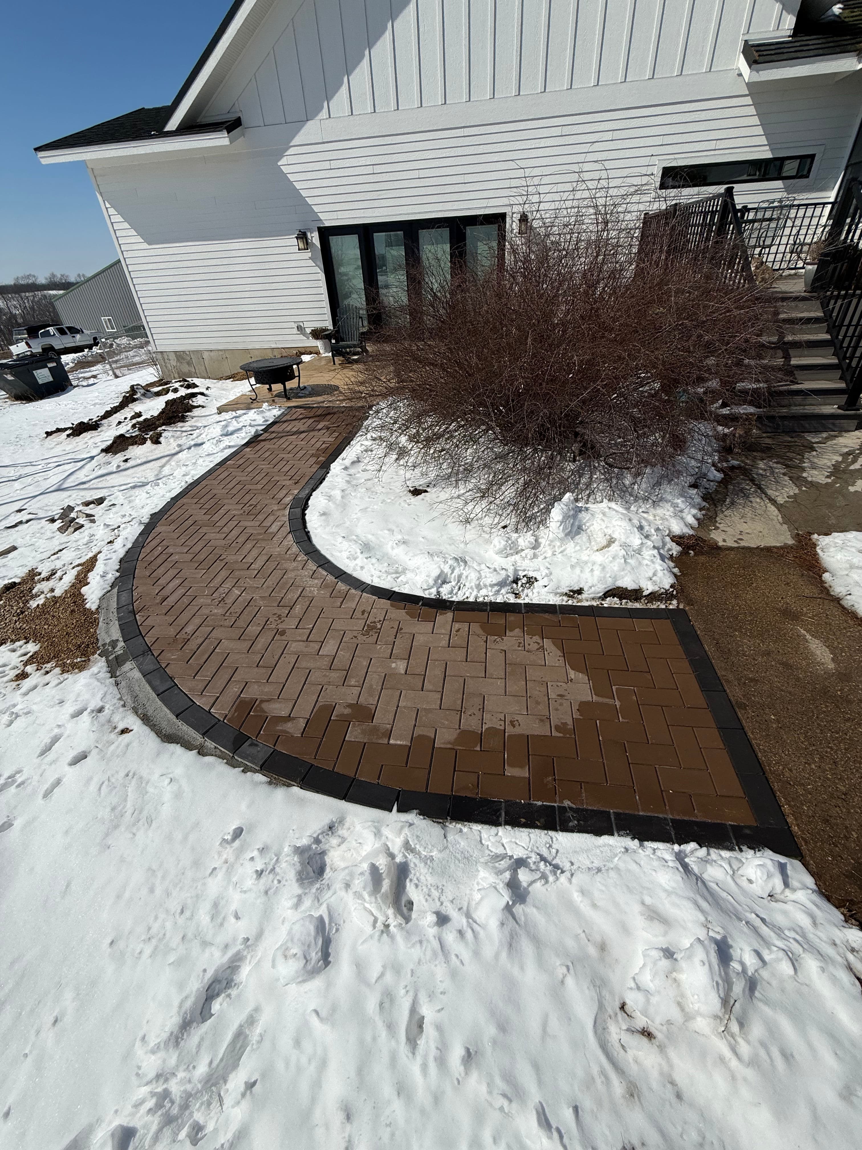 Project Curved Brick Paver Pathway Laid Right Through Winter image