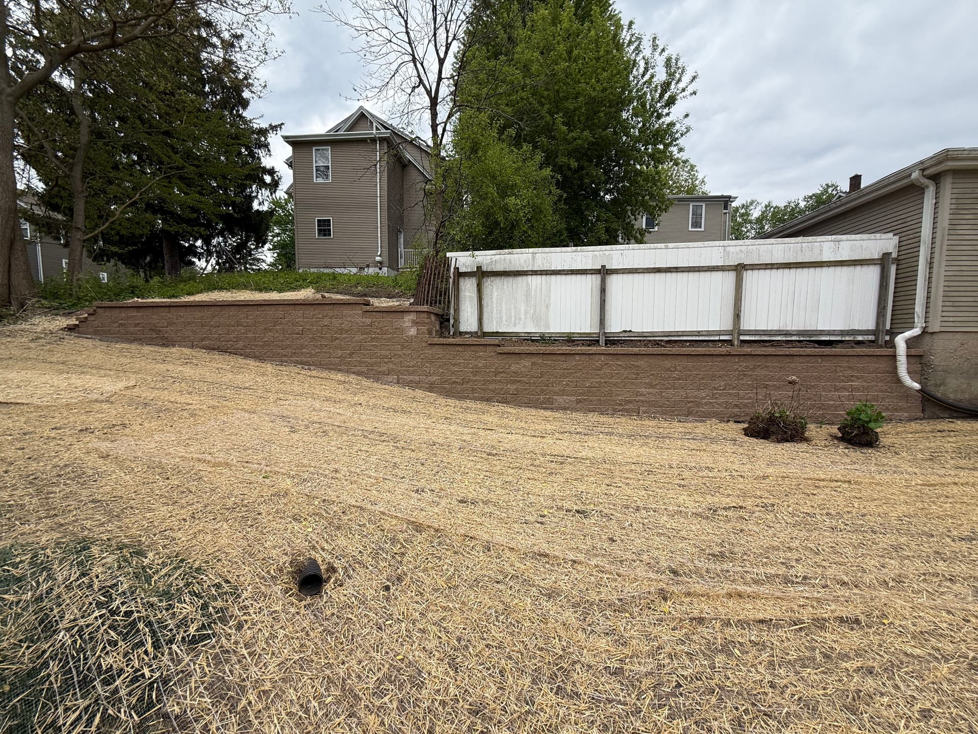 Gallery photos for Old Limestone Wall Replaced With New Block Retaining Wall in Dubuque: Image #1