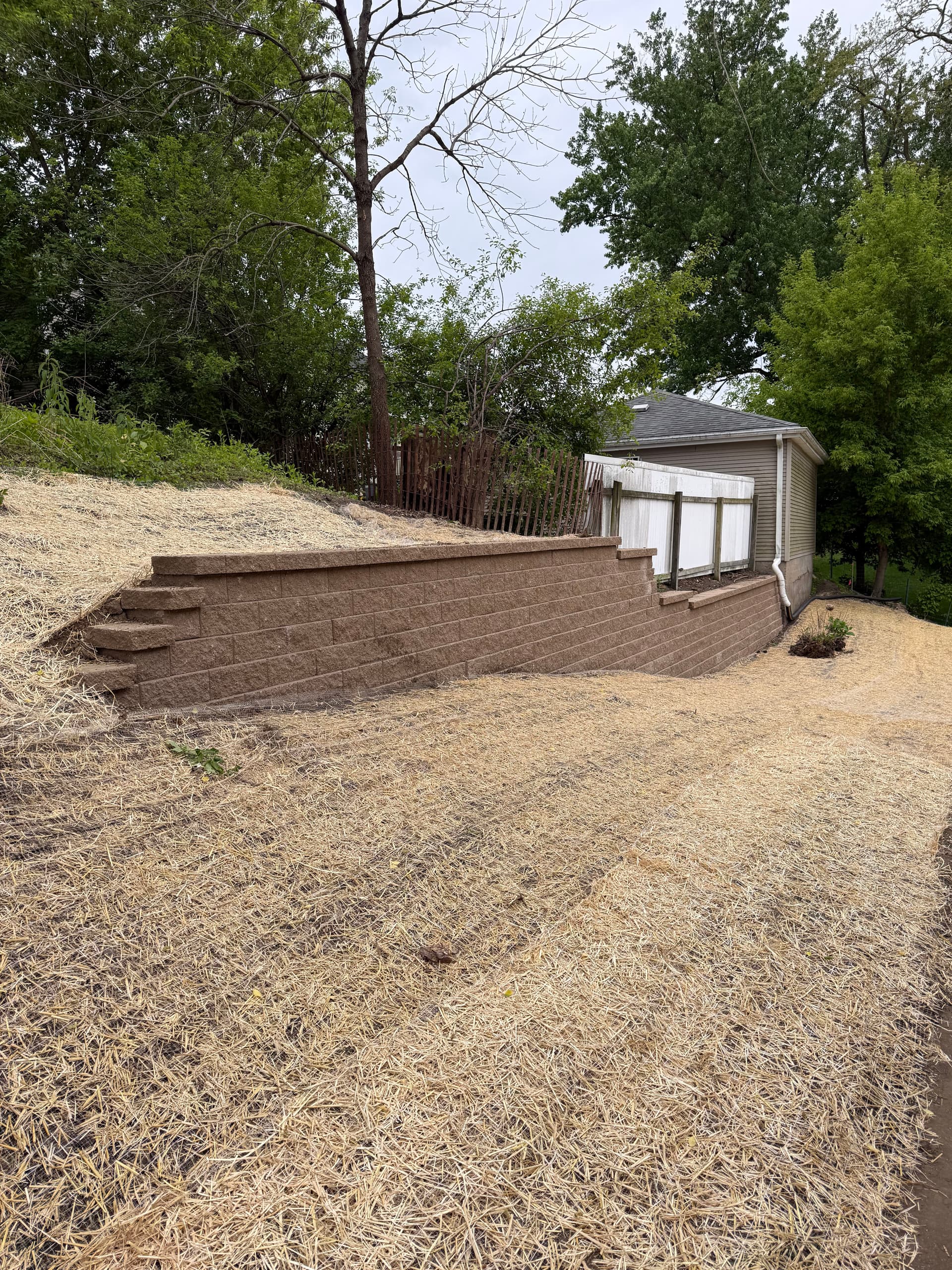 Old Limestone Wall Replaced With New Block Retaining Wall in Dubuque image